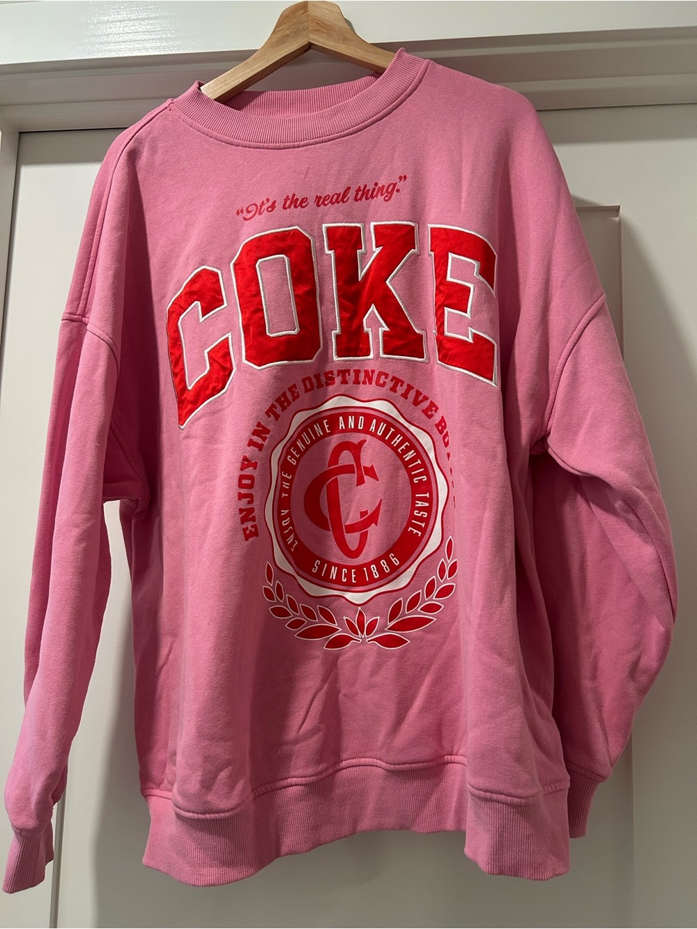 Pink Crewneck Sweatshirt with Red COKE Graphic